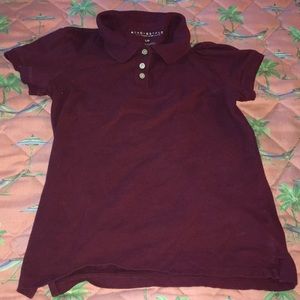 A burgundy polo shirt